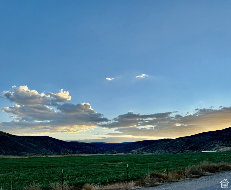 Property view of mountains with a rural view