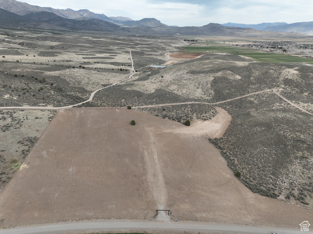Birds eye view of property with a rural view and a mountain view