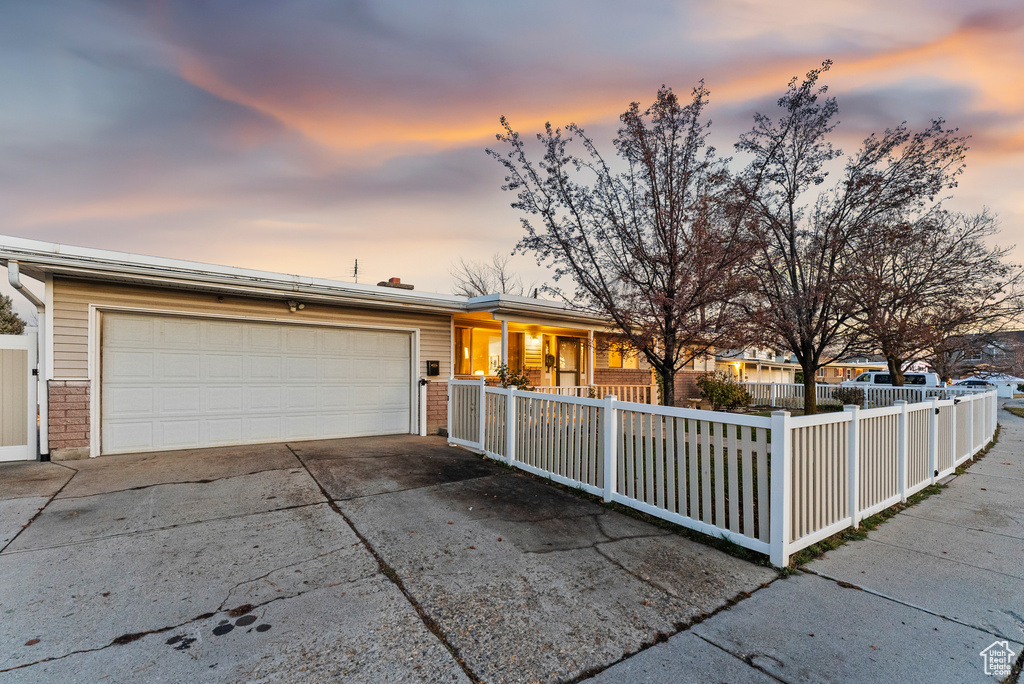 Ranch-style home featuring a garage