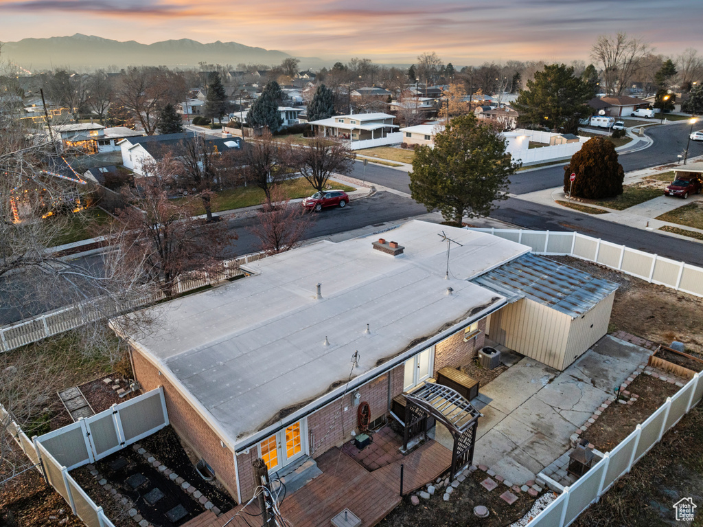 Aerial view at dusk featuring a mountain view