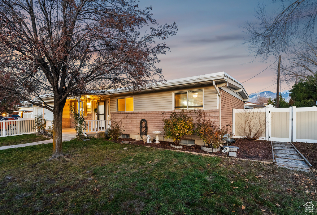 Ranch-style house with a yard