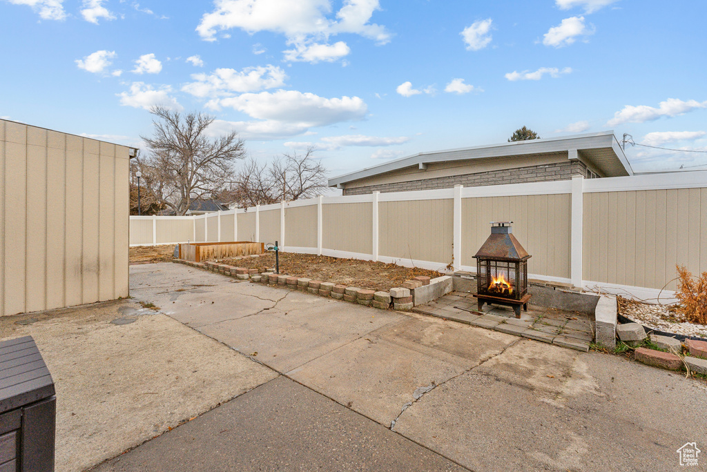 View of patio / terrace with a multi sided fireplace