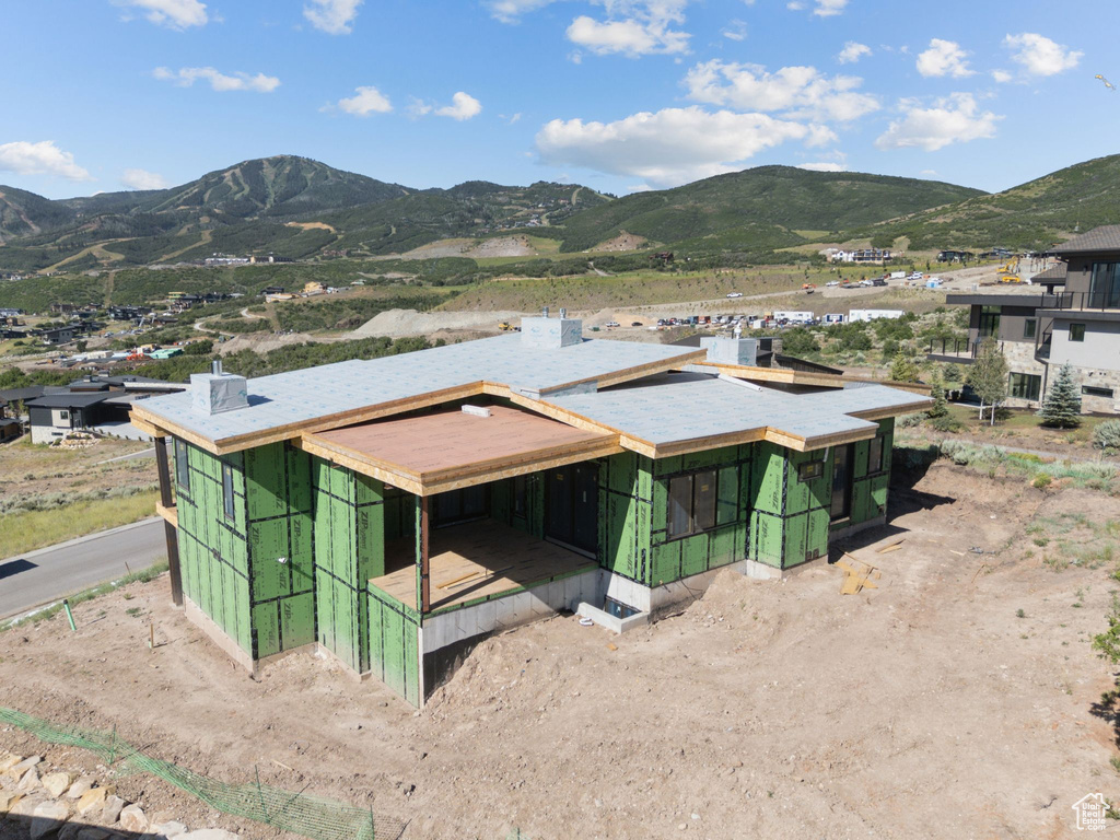 View of subject property with a mountainous background