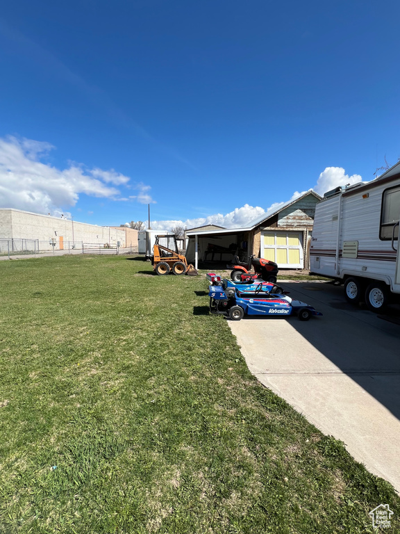 View of yard featuring fence