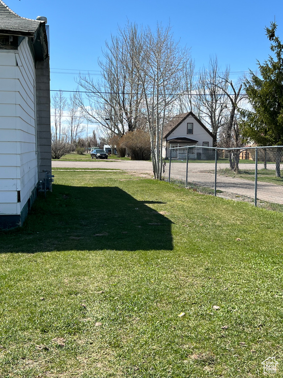 View of yard with fence