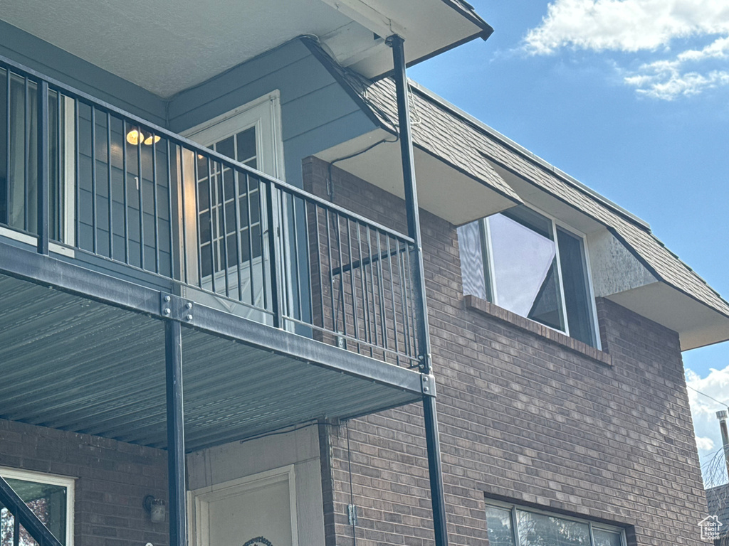 View of side of property featuring a balcony