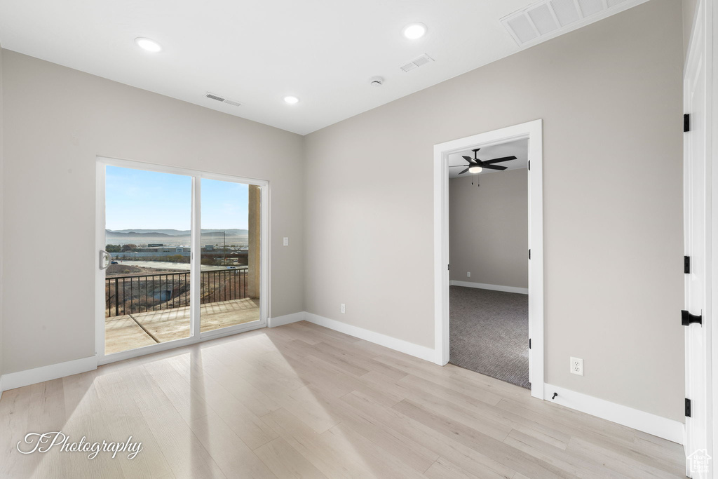 Spare room featuring light hardwood / wood-style flooring and ceiling fan