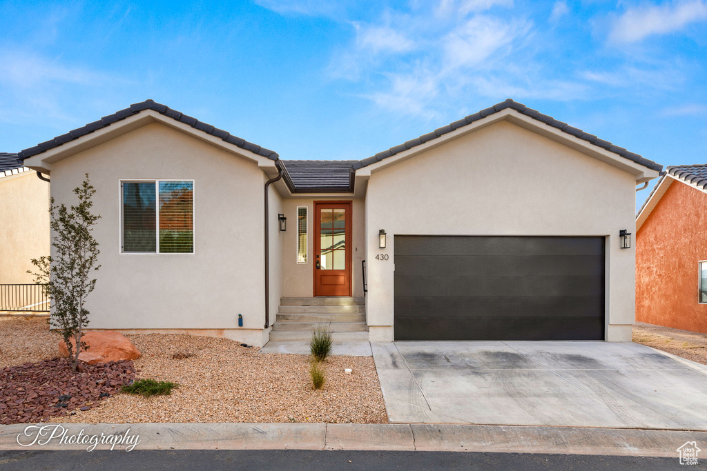 Single story home with a garage