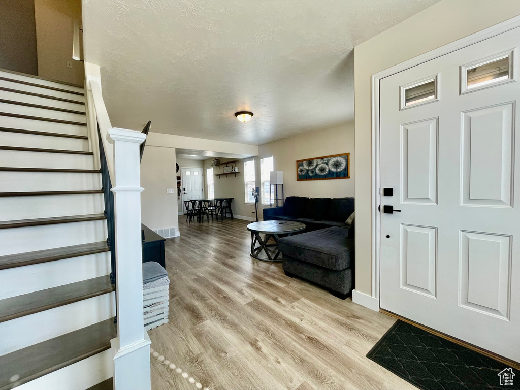 Entryway with light wood-type flooring