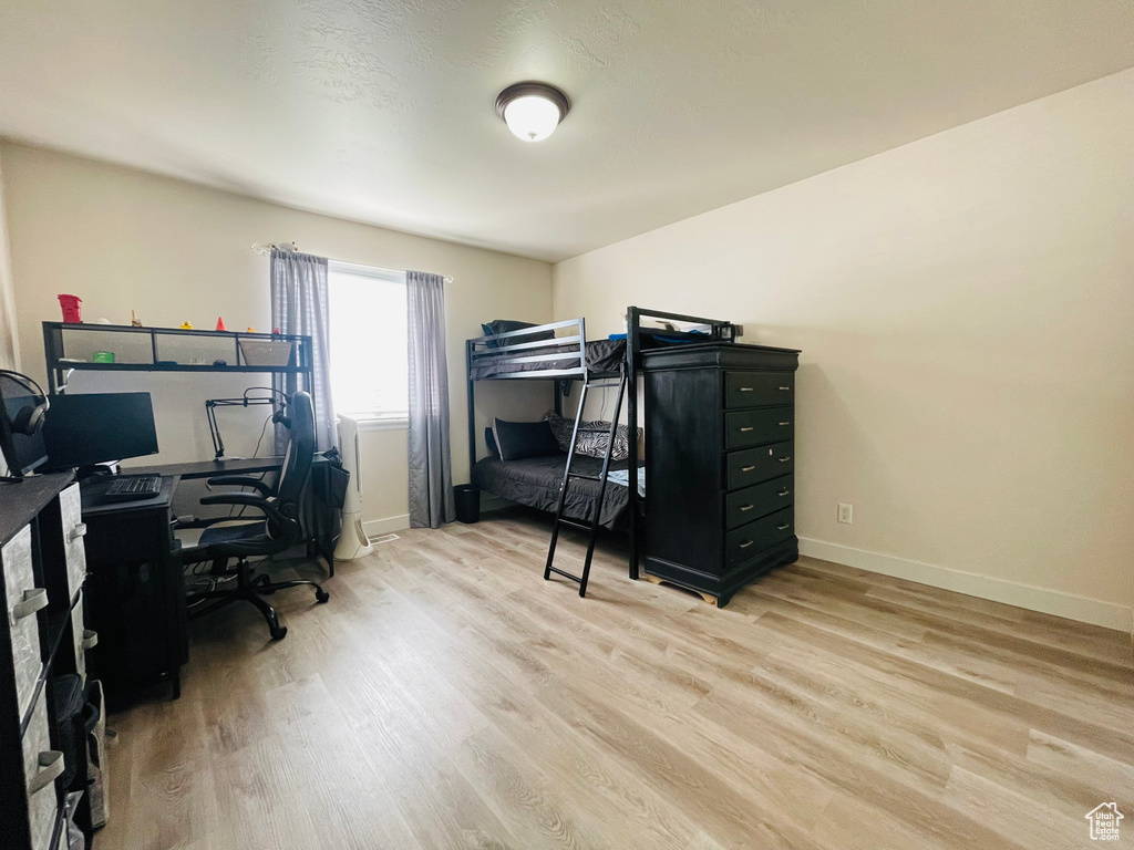 Bedroom with light wood-type flooring