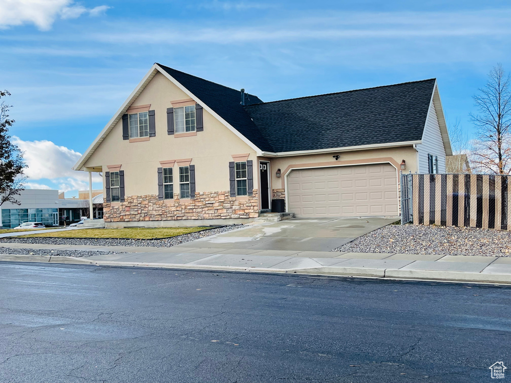 View of property with a garage