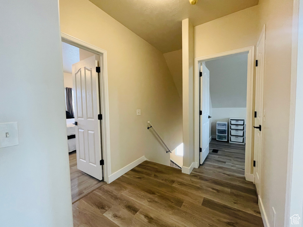 Corridor featuring dark hardwood / wood-style flooring