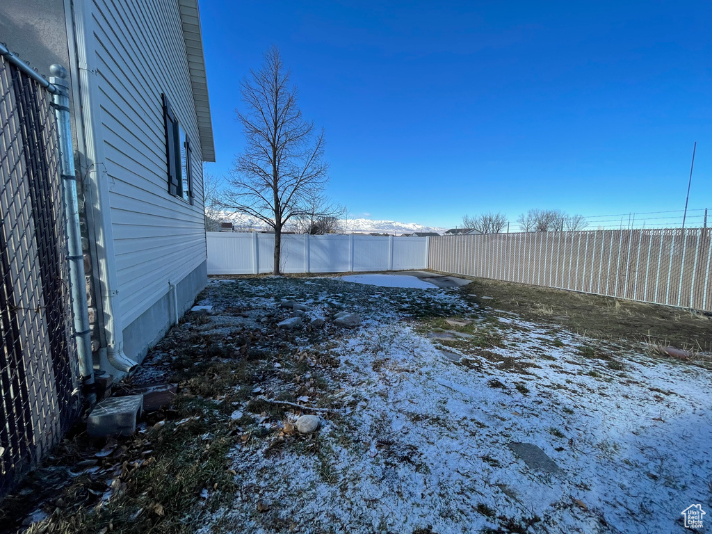 View of yard layered in snow