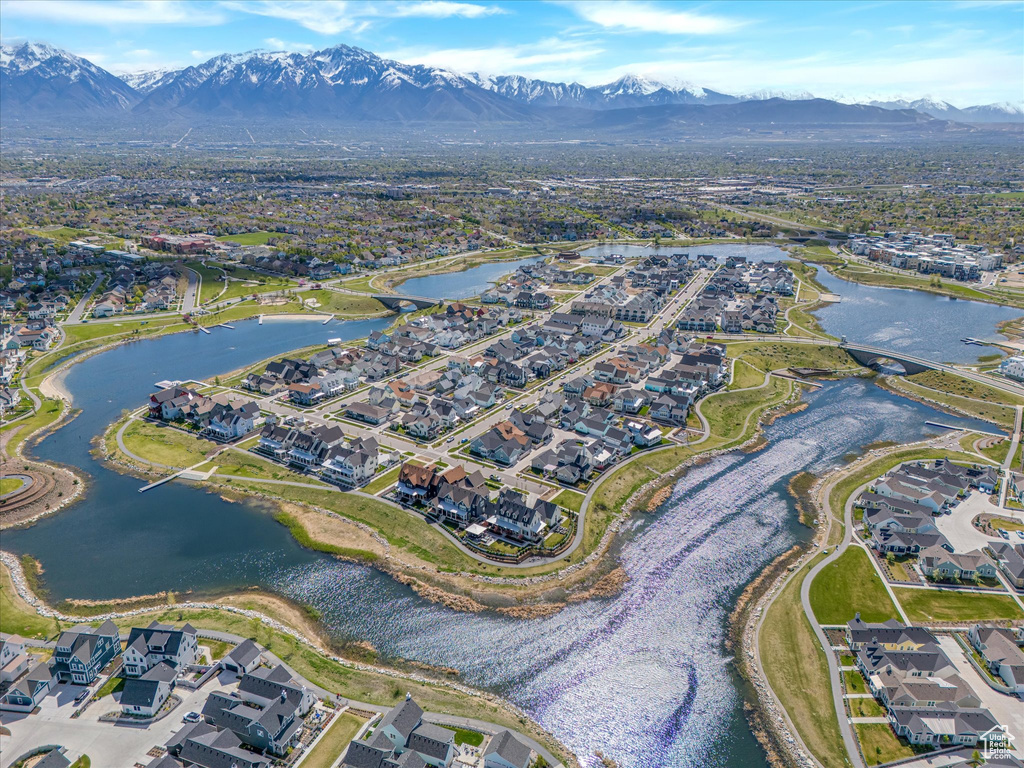 Drone / aerial view featuring a water and mountain view