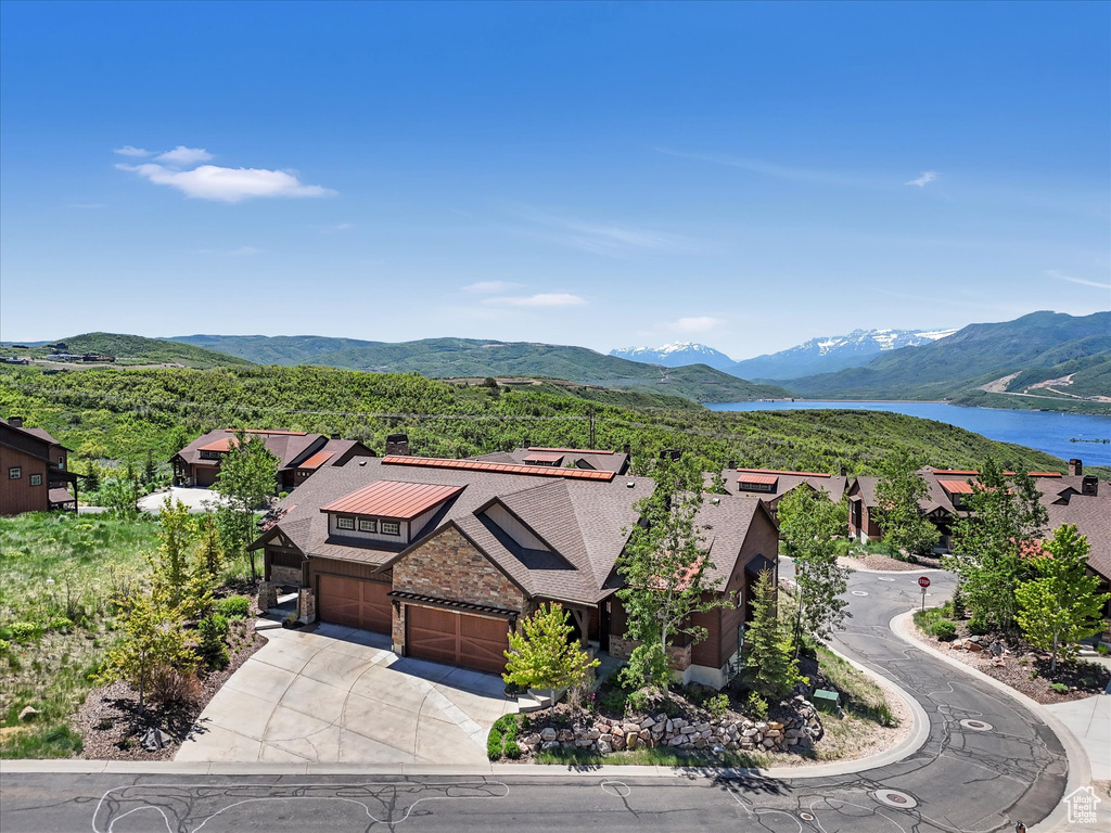 View of mountain backdrop featuring a large body of water