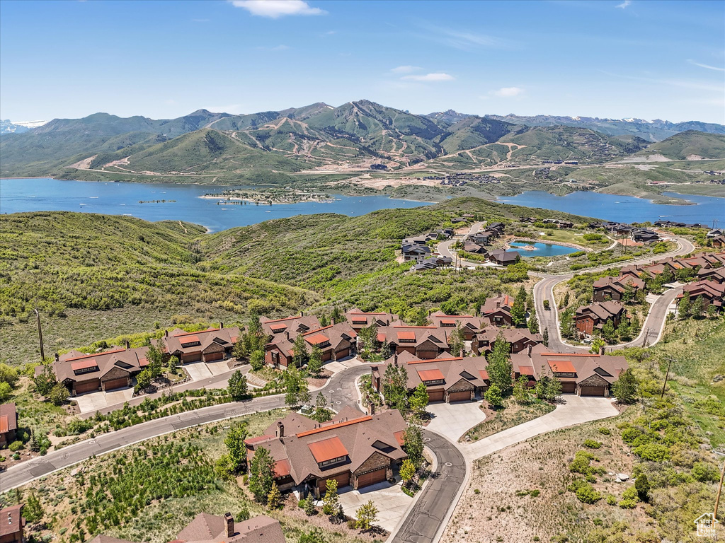 Aerial perspective of suburban area with a water and mountain view