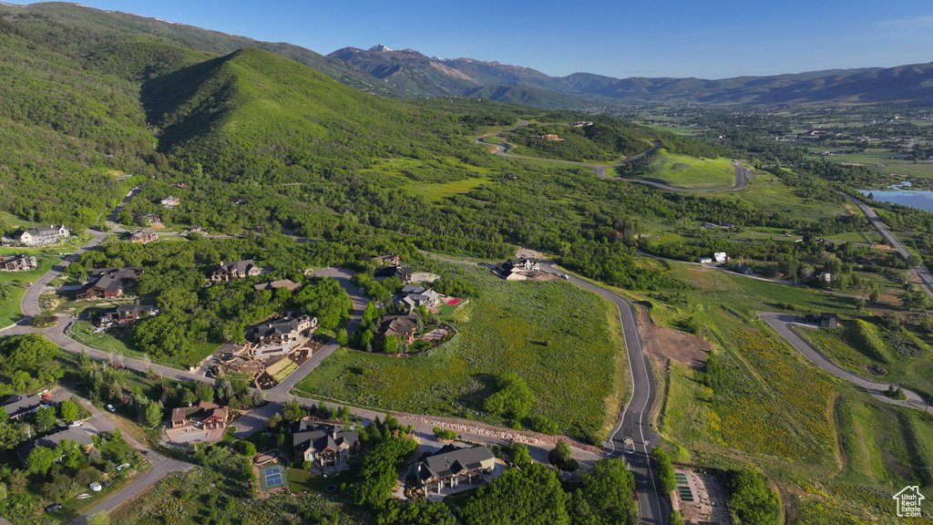 Aerial view of property\'s location with a mountain backdrop