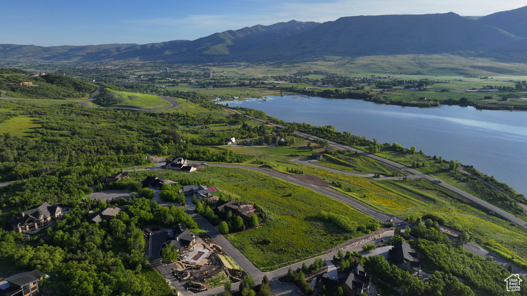 Aerial view of property\'s location featuring a water and mountain view