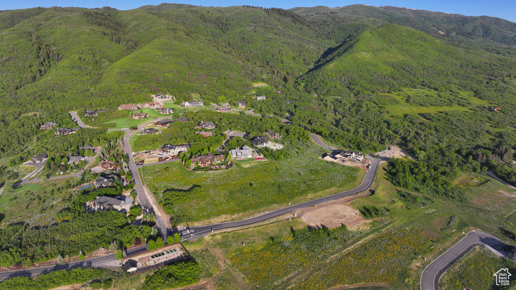 Aerial view of property's location featuring mountains