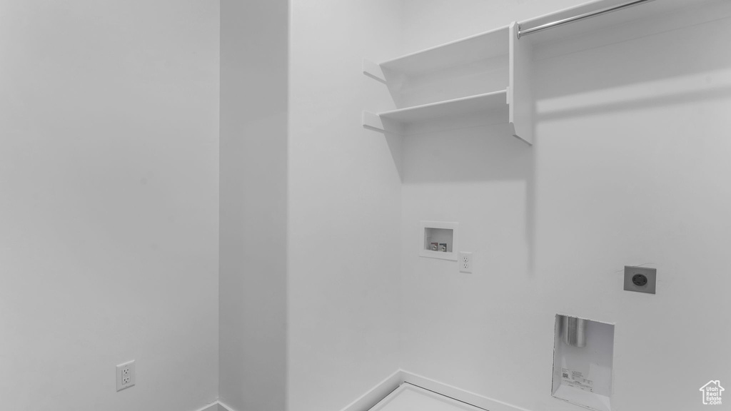 Laundry area with washer hookup, electric dryer hookup, and baseboards