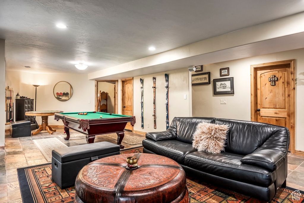 Rec room featuring billiards table, stone tile flooring, recessed lighting, and baseboards