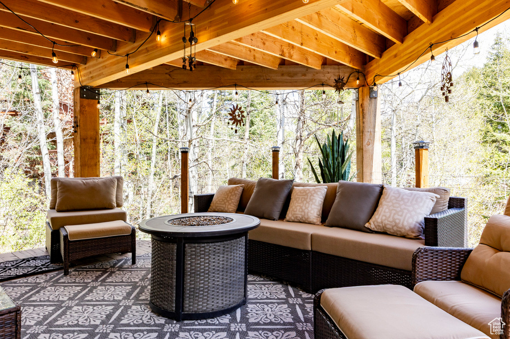 View of patio / terrace with an outdoor living space with a fire pit