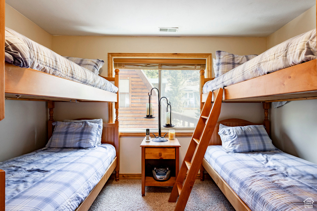 Bedroom with light carpet