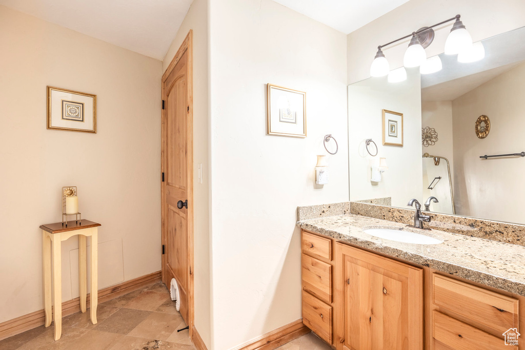 Bathroom with baseboards and vanity