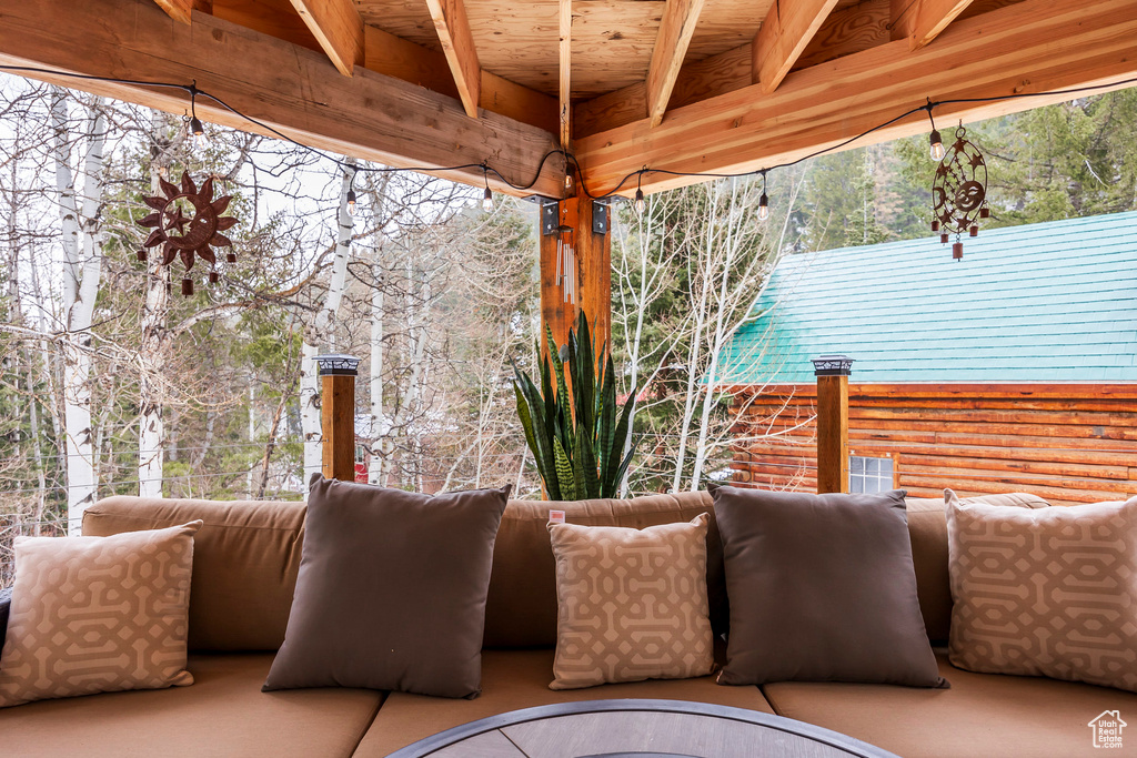 View of patio featuring a balcony