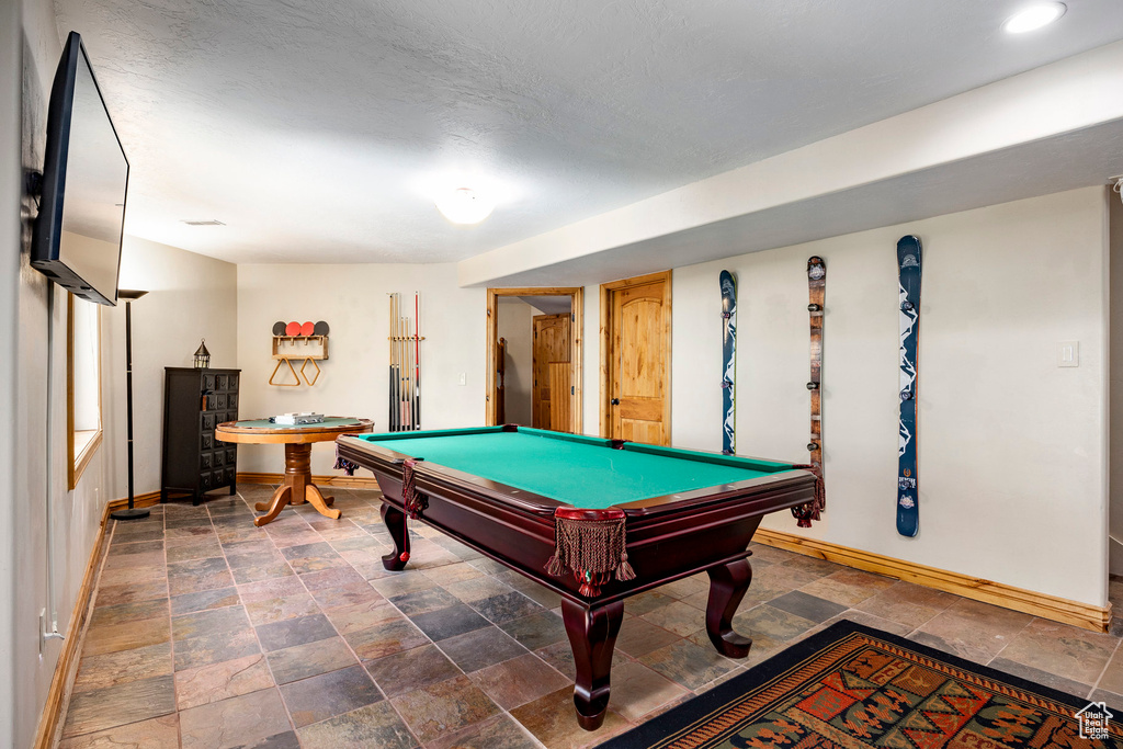 Rec room with baseboards, stone finish flooring, pool table, and recessed lighting