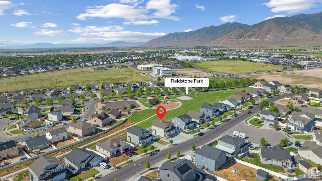 Aerial overview of property's location with mountains and nearby suburban area