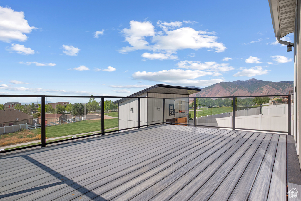Wooden terrace with a mountain view and an outdoor structure