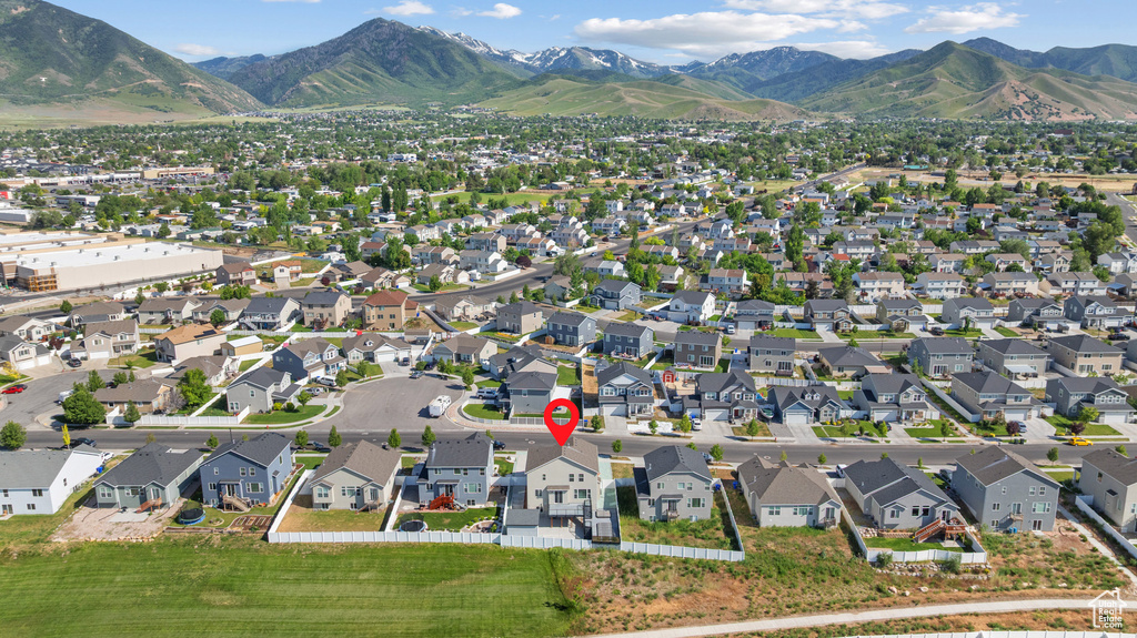 View of property location featuring a mountainous background and nearby suburban area