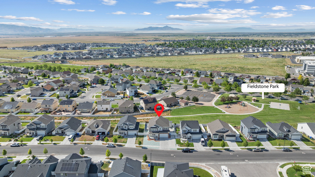 Aerial view of residential area featuring a mountain backdrop