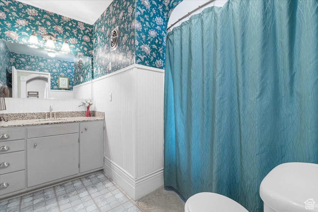 Bathroom with vanity and toilet