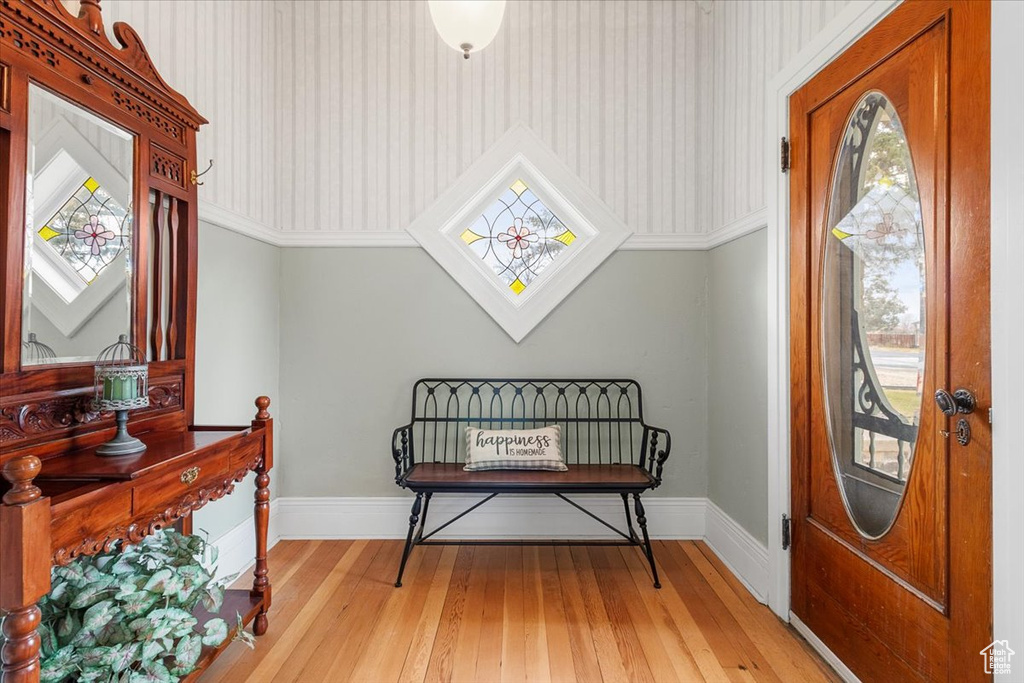 Sitting room featuring light wood-type flooring and plenty of natural light