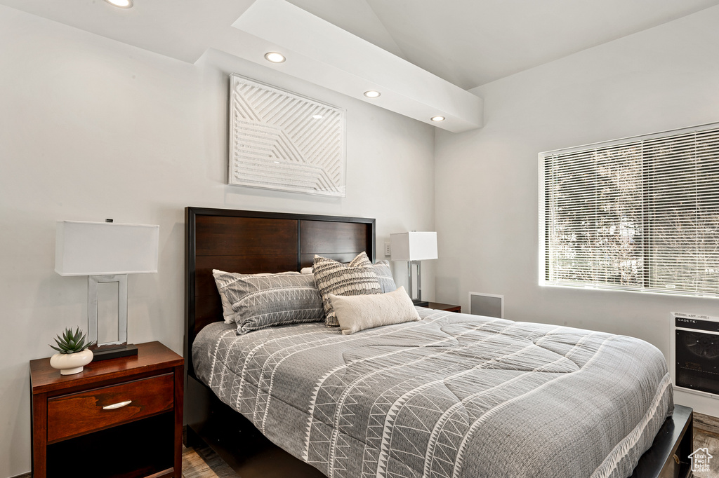 Bedroom with recessed lighting and lofted ceiling