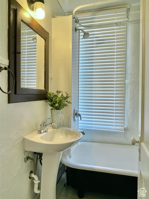 Bathroom with a tub to relax in