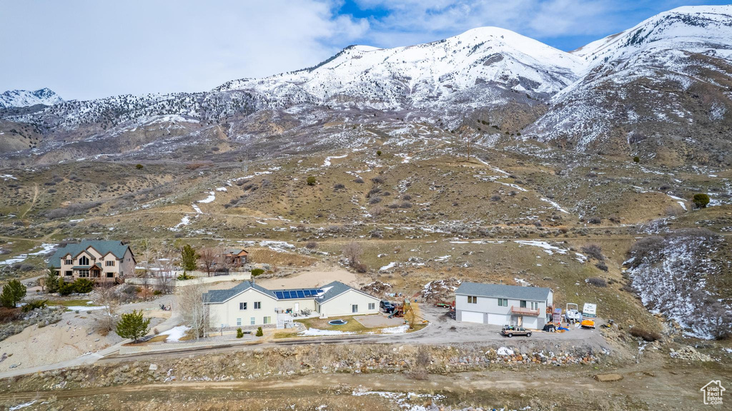 Snowy aerial view featuring a mountain view