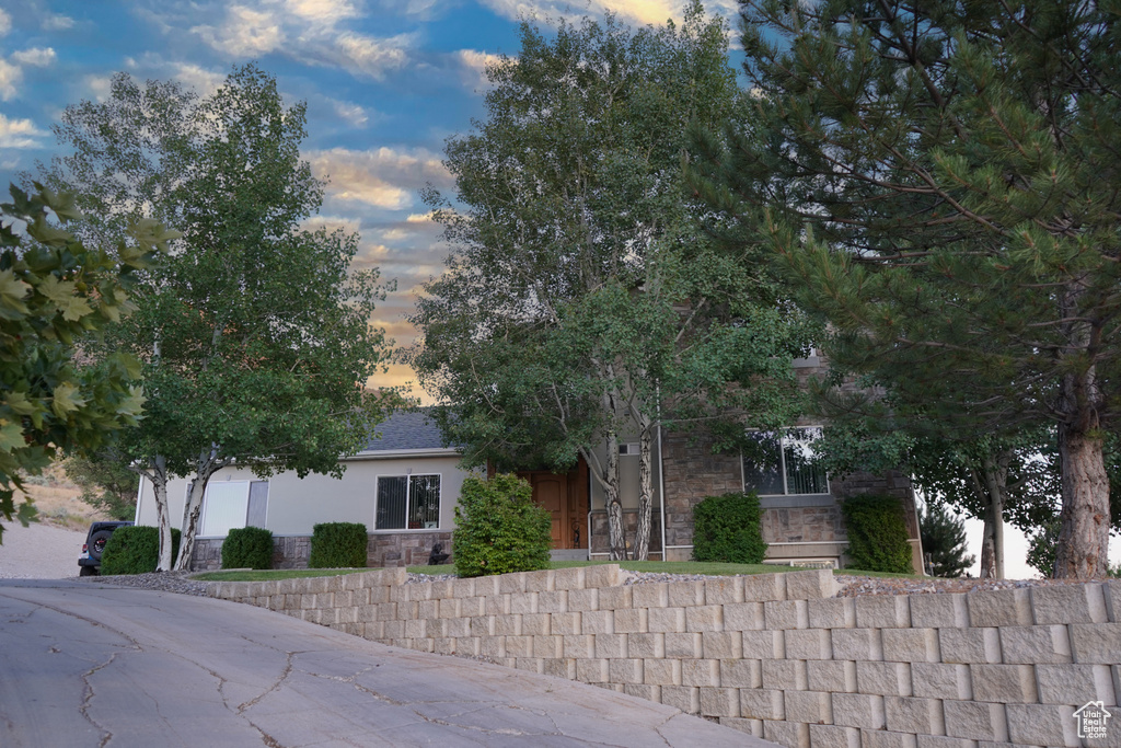 View of property hidden behind natural elements