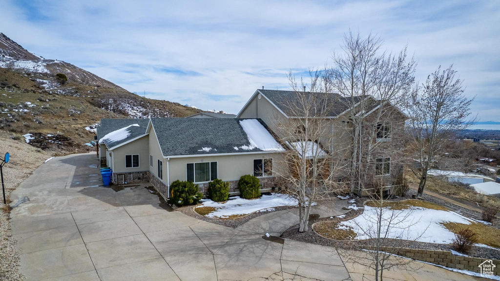 View of snow covered exterior with a mountain view