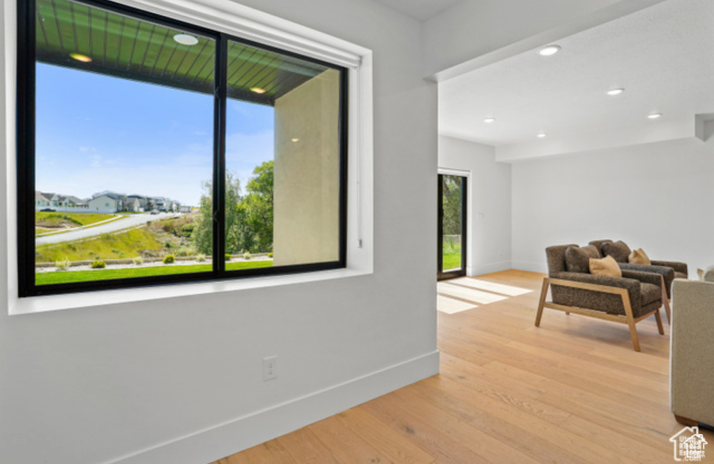 Interior space with a healthy amount of sunlight and light hardwood / wood-style floors