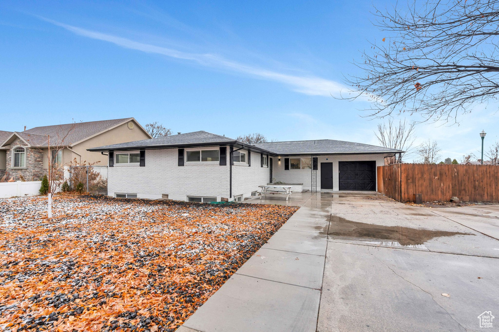 Single story home with a garage