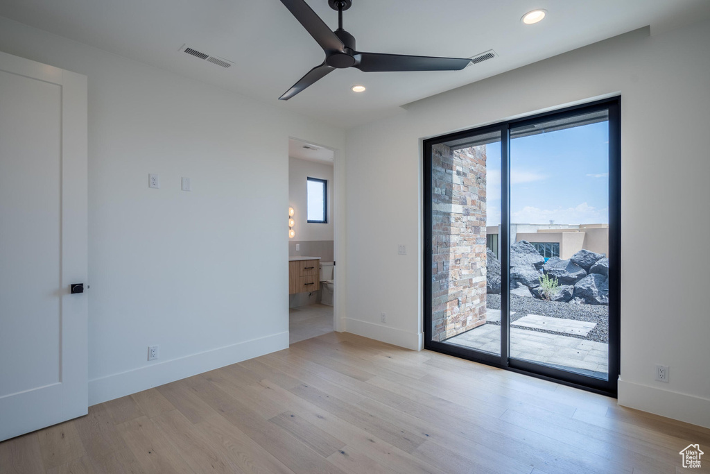 Unfurnished room featuring light hardwood / wood-style floors and ceiling fan