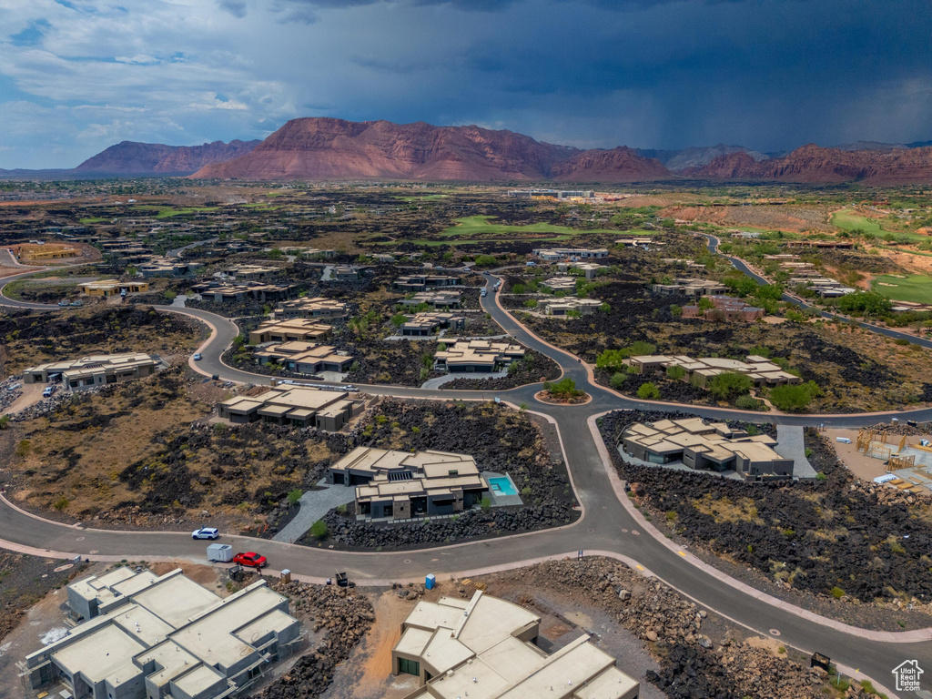 Birds eye view of property with a mountain view