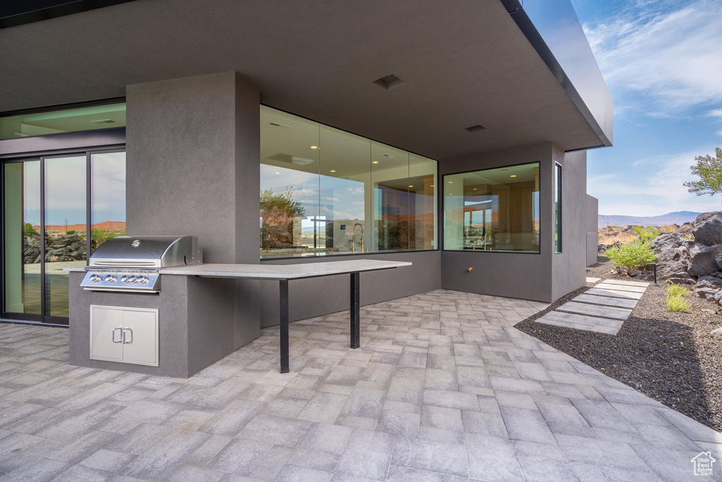 View of patio / terrace featuring a mountain view, area for grilling, and grilling area