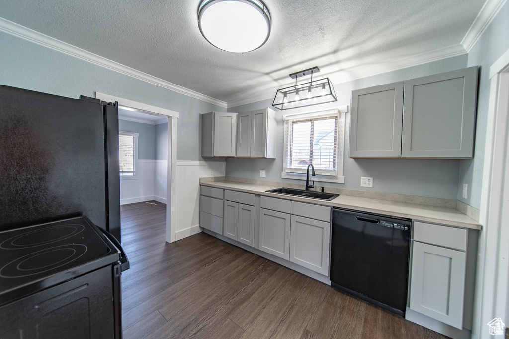 Kitchen featuring refrigerator, sink, electric range, dishwasher, and gray cabinets