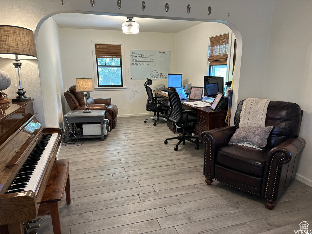 Office with light wood-type flooring