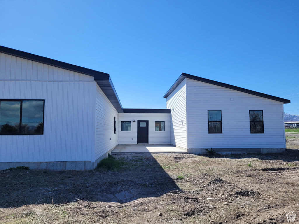 Rear view of house featuring a patio area