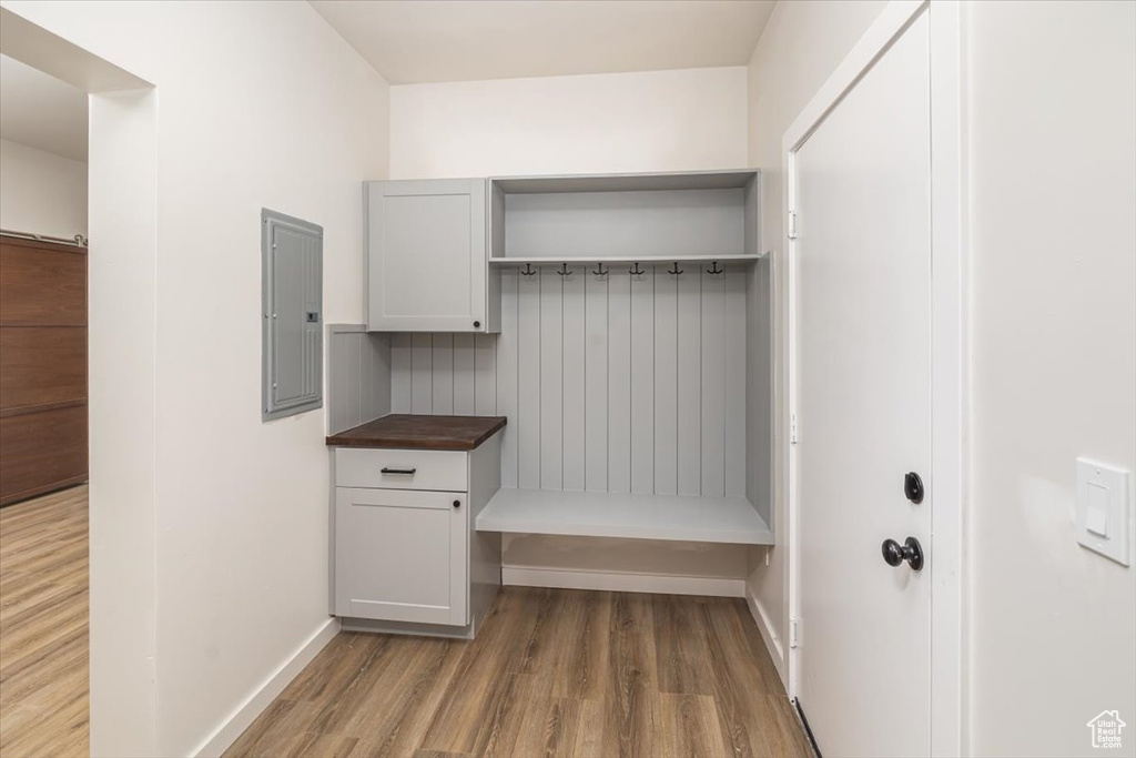 Mudroom featuring hardwood / wood-style flooring and electric panel